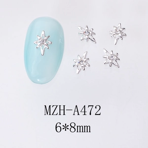 Vue détaillée de bijoux d'ongles étoiles en argent avec strass et dimensions 6x8mm