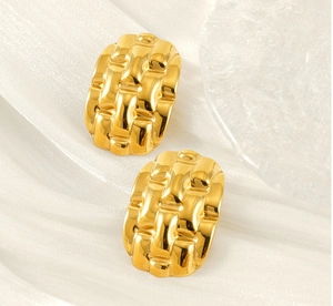 Macro view of 18k gold plated stainless steel earrings with woven textured pattern