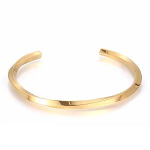 Gold twisted stainless steel C-shaped open cuff bracelet in minimalist geometric style