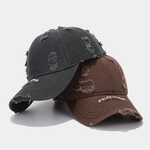 Distressed cotton baseball cap with FTUL CLUB embroidery and torn details on the brim