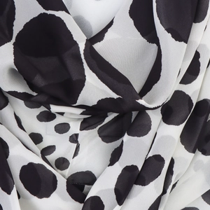 Elegante abito senza maniche con schiena scoperta e motivo a pois bianco e nero