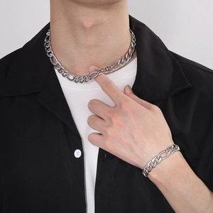 On-model view of a hip hop style two-tone titanium steel 3:1 link chain jewelry set