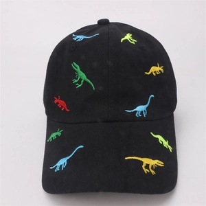 Close-up of colorful dinosaur embroidery on a black cotton baseball cap for kids