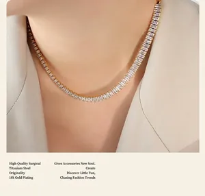 Detail of 18K gold plated titanium steel tennis necklace with rectangular zircons on model