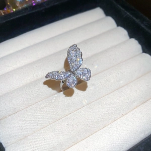 Elegant silver butterfly open ring with sparkling cubic zirconia on white velvet box