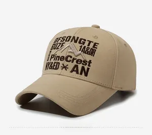Detailed close-up of mountain embroidery on khaki vintage baseball cap with cotton texture