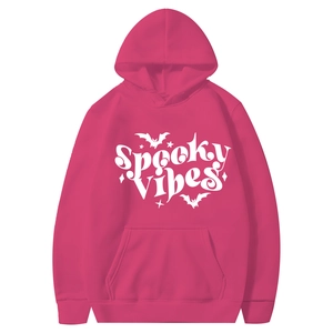 Close-up of pink Halloween hoodie showing the white Spooky Vibes text and bat print details