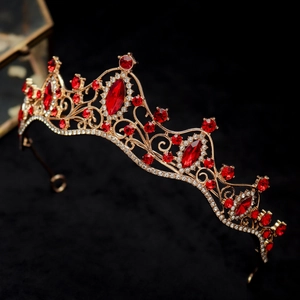 Baroque gold bridal tiara with red rhinestones and white crystals on black velvet