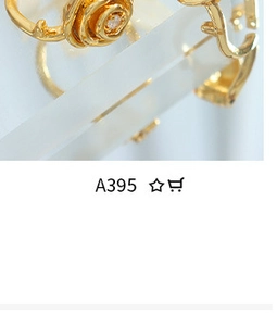 Macro shot of 18K gold plated geometric rose earrings with a central clear gemstone