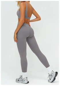 Detail view of charcoal gray high-waist yoga pants with seamless push-up lifting effect