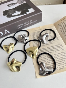 Detail of 6pcs gold and silver metallic hair ties with irregular geometric shapes