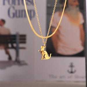 Double-layered gold titanium necklace featuring a modern sitting cat pendant on O-chain