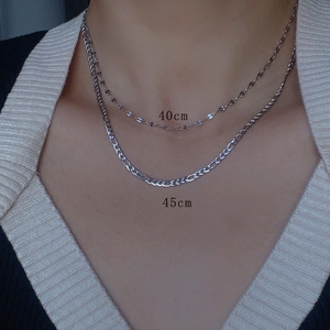 Layered silver titanium steel necklaces with 40cm and 45cm chains on neck