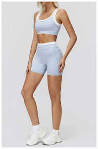 Detail view of light blue seamless yoga set featuring racerback bra and high waist shorts