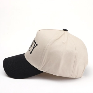 Side view of two-tone canvas baseball cap with black EY embroidery and contrast brim