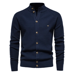 Detailed view of navy blue waffle knit texture and buttons on men cardigan sweater