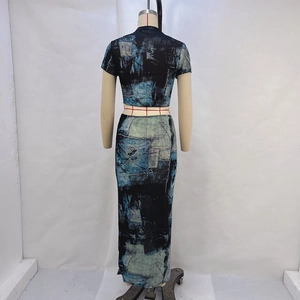 Back view of a cropped short-sleeve top and slim-fit maxi skirt with abstract blue print