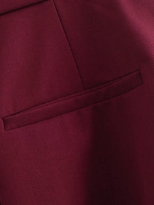 Detailed view of pocket stitching on burgundy twill jacket showing high quality craftsmanship