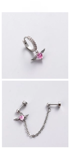 Detail of titanium steel pink heart stud earrings with wings and chain connection