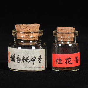 Ancient handmade pear and osmanthus incense powder in glass bottles with cork lids