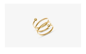 Macro detail of triple-layer gold spiral ring with twisted rope texture and dual metal beads