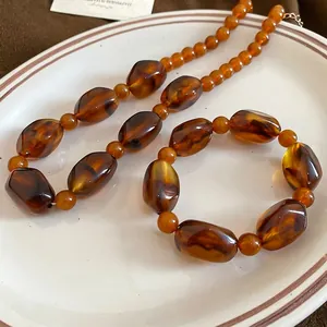 Retro amber acrylic jewelry set with tortoiseshell texture necklace and bracelet