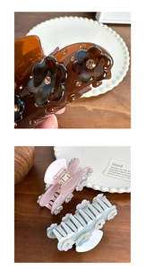 Close-up of acetate floral hair claws with rhinestones in brown, pink, and blue colors