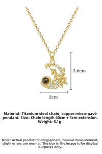 Macro detail of gold Pegasus Moon necklace with zircon inlay and projection stone