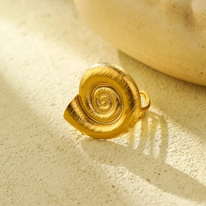 Golden stainless steel ocean-themed starfish spiral ring with brushed metal texture