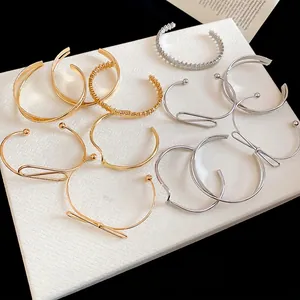 Minimalist polished metal open cuff bracelet set in gold and silver finish for women