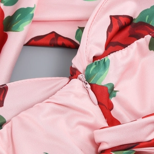 Detailed macro view of the invisible zipper on a floral pink rose satin dress