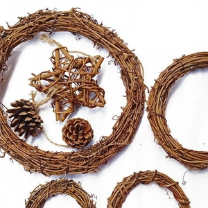 Natural handmade rattan wreaths and star decor with pine cones for Christmas DIY crafts