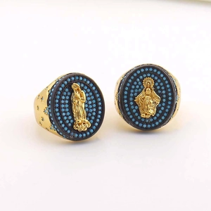 Golden Virgin Mary rings with turquoise beads and black base on minimalist white background