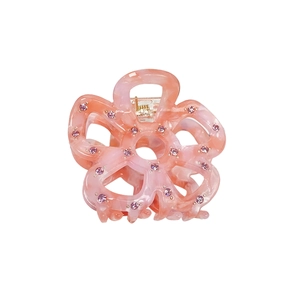 Pink marble acetate flower hair claw clip with rhinestones shown on white background