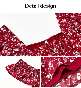 Detail view of floral square neck top with ruffle sleeves and size S tag on the collar