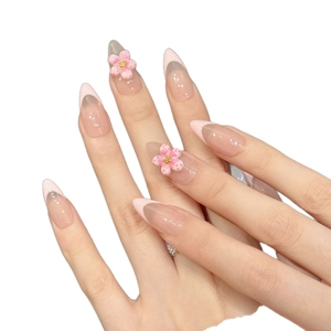 Handmade light pink French almond press-on nails with 3D flower and glitter accents