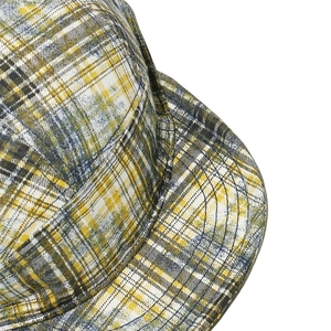 Detailed close-up of colorful checkered fabric and stitching on a 5-panel baseball cap