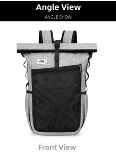 Detail of grey roll-top travel backpack featuring a front black mesh pocket and buckle closure