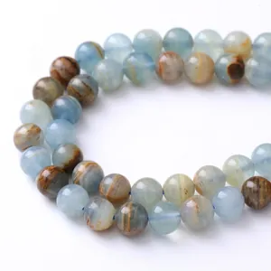 Natural light blue calcite round beads for jewelry making with unique mineral patterns
