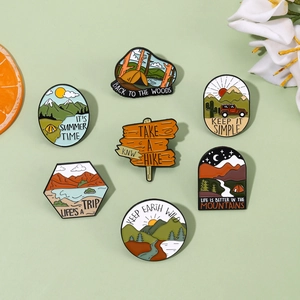 Outdoor nature enamel pin set featuring mountain forest and hiking designs for jackets