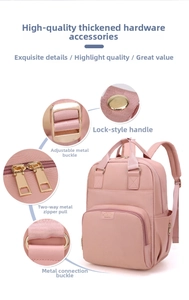 Detailed views of premium gold-tone metal hardware and zippers on a pink maternity backpack