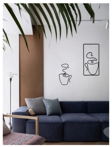 Modern black metal wire coffee cup wall art decorations displayed above a sofa