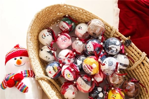 Christmas coral fleece socks set in clear sphere gift balls displayed in a woven basket
