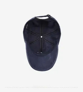 Internal view of navy washed cotton baseball cap with XTMY label and metal buckle