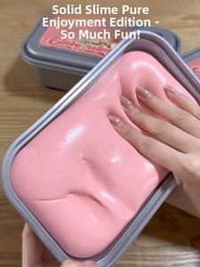 Detailed close-up of pink solid slime being pressed in a gray plastic storage container