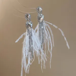 Elegant white feather tassel earrings with teardrop crystal studs for luxury evening wear