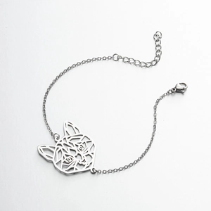 Detail of silver stainless steel bracelet featuring a hollow geometric cat head pendant