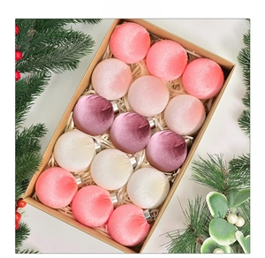 Set of 12 velvet Christmas ornaments in shades of pink inside a craft gift box