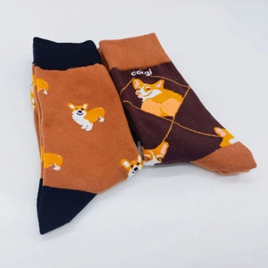 Detail of cute cartoon Corgi patterns and ribbed cuffs on knit mid-calf socks