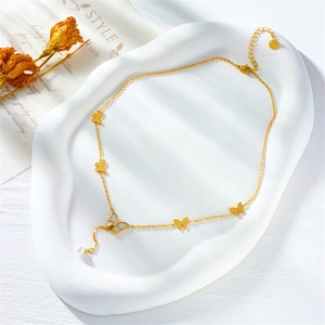 Elegant gold butterfly necklace with mother of pearl pendant and white pearl drop